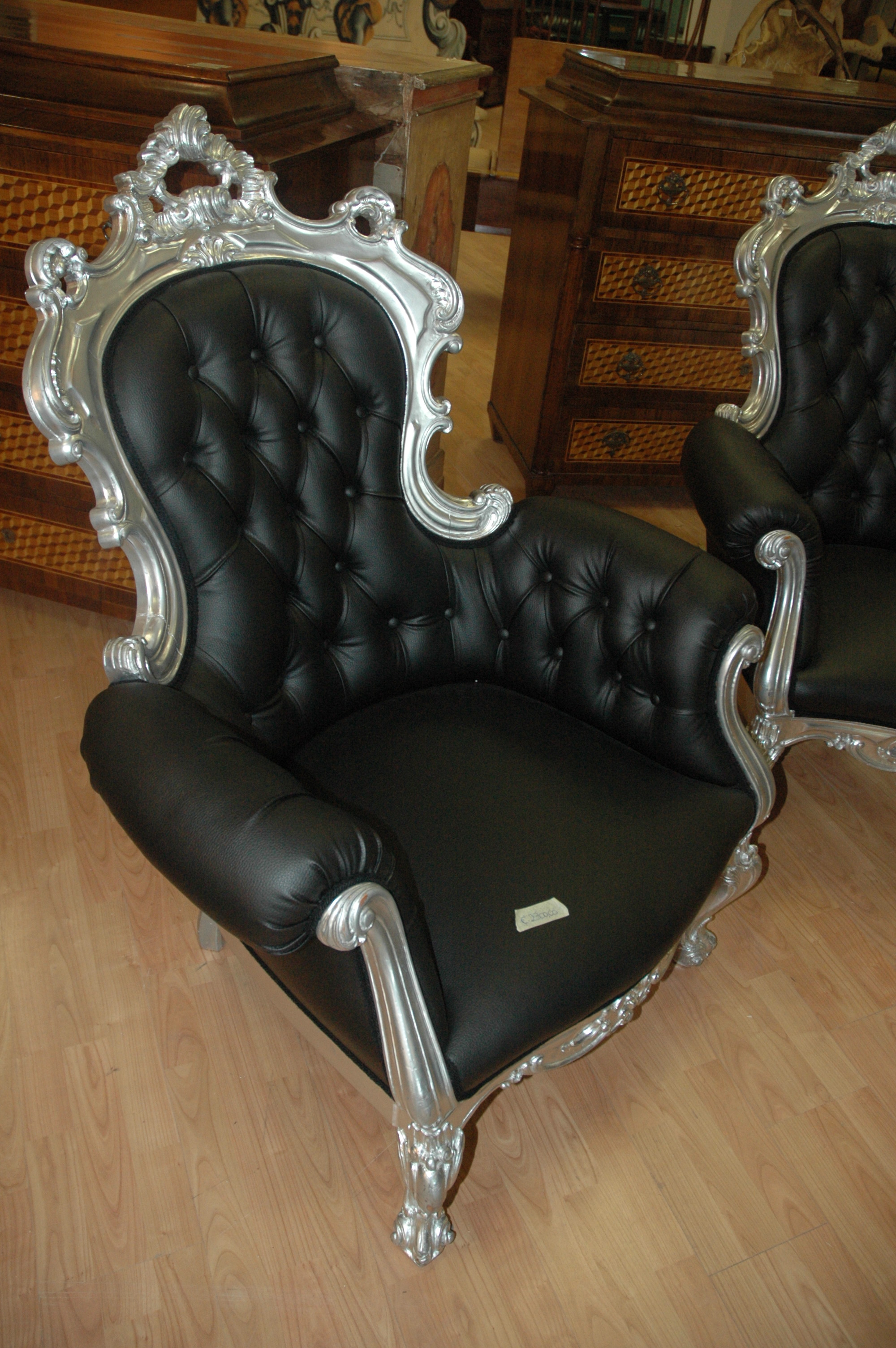 antiquariato: A couple of armchair, silvered wood and leather