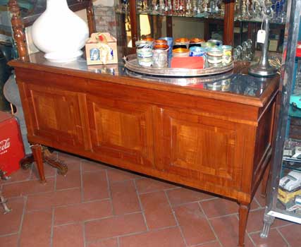 wooden counter, with a big drawer for exposition