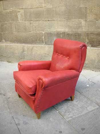 Model of Frau armchair, in red leather